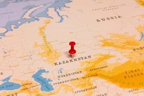 A Red Pin on Kazakhstan on the World Map (© Shutterstock/hyotographics) 