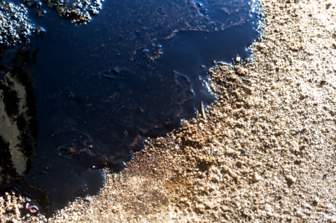 Crude oil spill on sand (© Shutterstock/Pix One) 