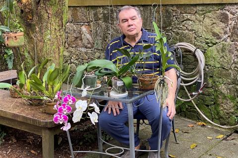 Marcelino Guedes Gomes together with his orchids