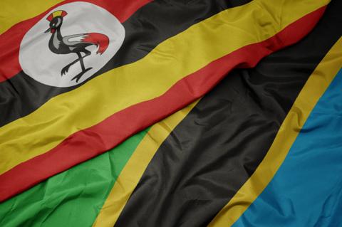 The national flag of Uganda and flag of Tanzania (© Shutterstock/esfera) 