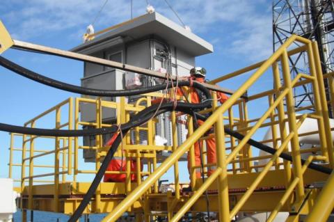 An Intertec GRP shelter being installed on the North Sea platform. (Copyright by INTERTEC)